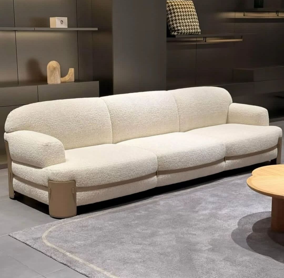 Ivory boucle three-seater sofa with rounded arms