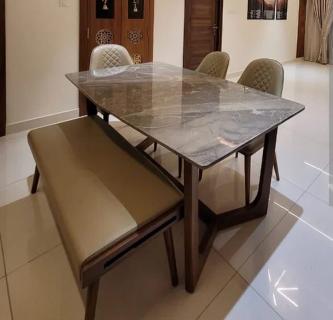 Marble-top dining table with upholstered bench