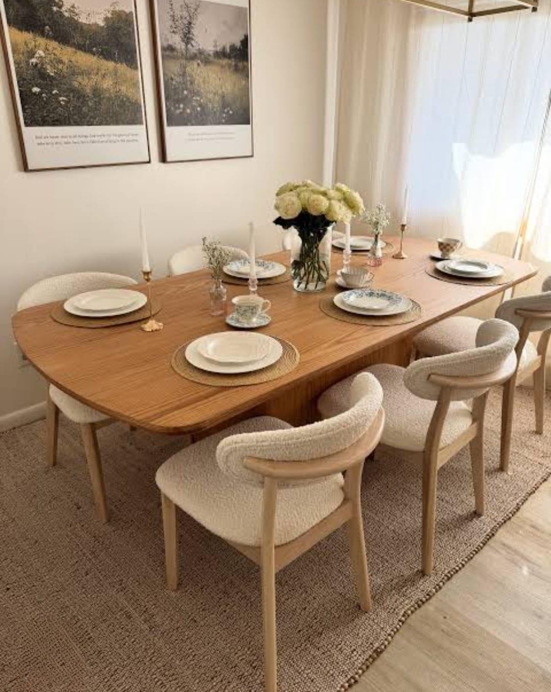 Oval oak dining table with curved upholstered chairs