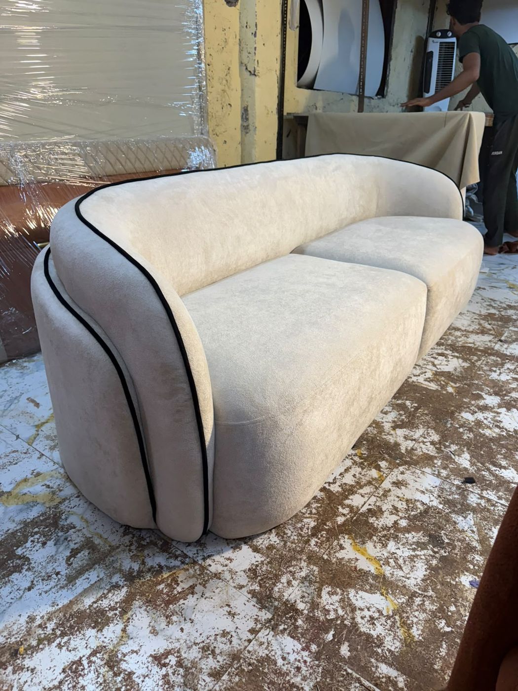 Curved sofa with contrast black piping