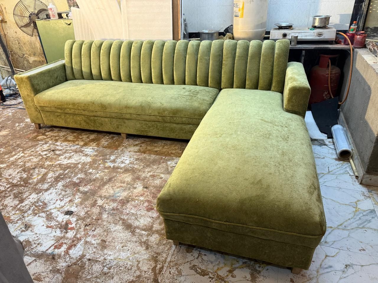 Green velvet L-shaped sofa